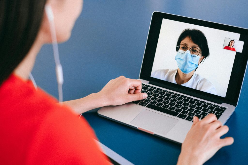 pexels-photo-4225920-4225920 Doctor and patient on a video call for telehealth consultation during COVID-19 era.